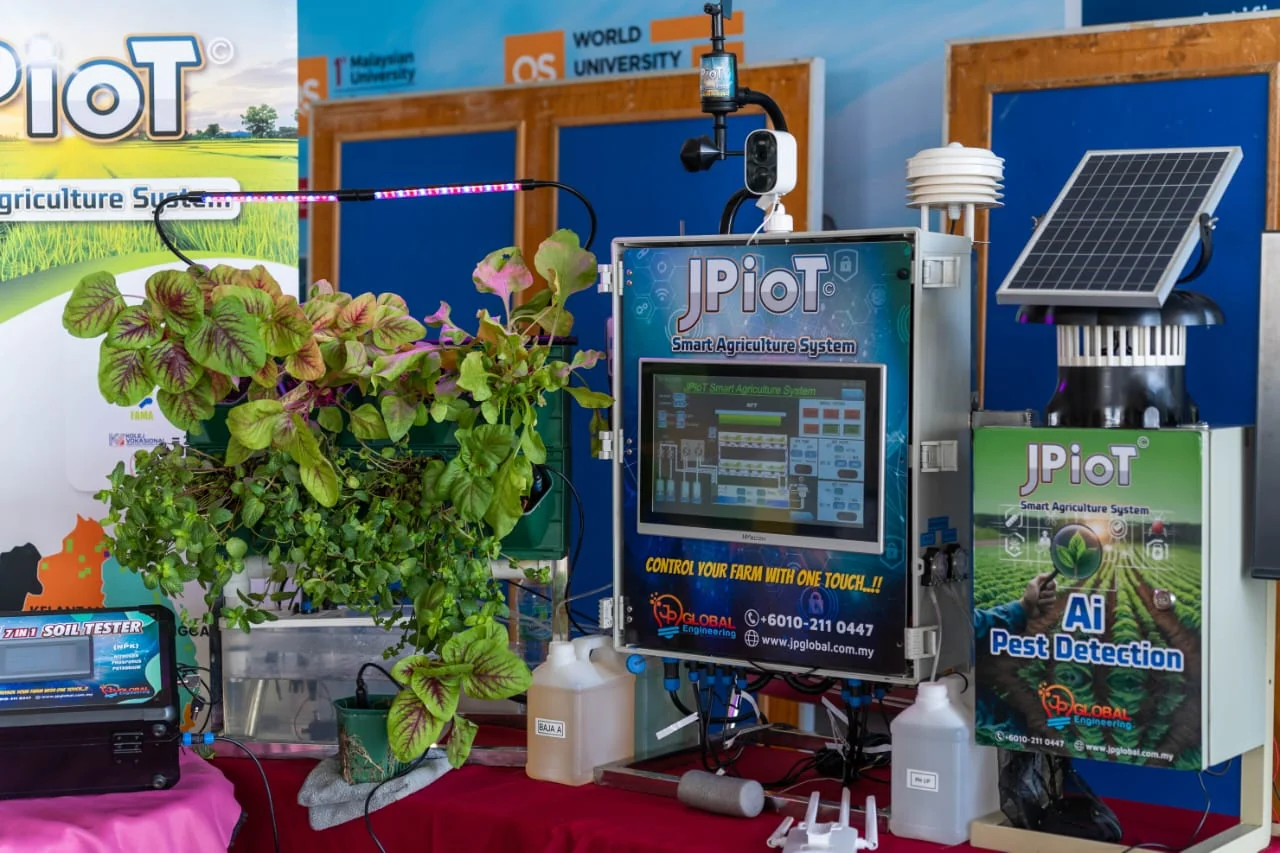 A JPIoT controller, AI Pest Detection unit and sensors set up on an exhibition stand